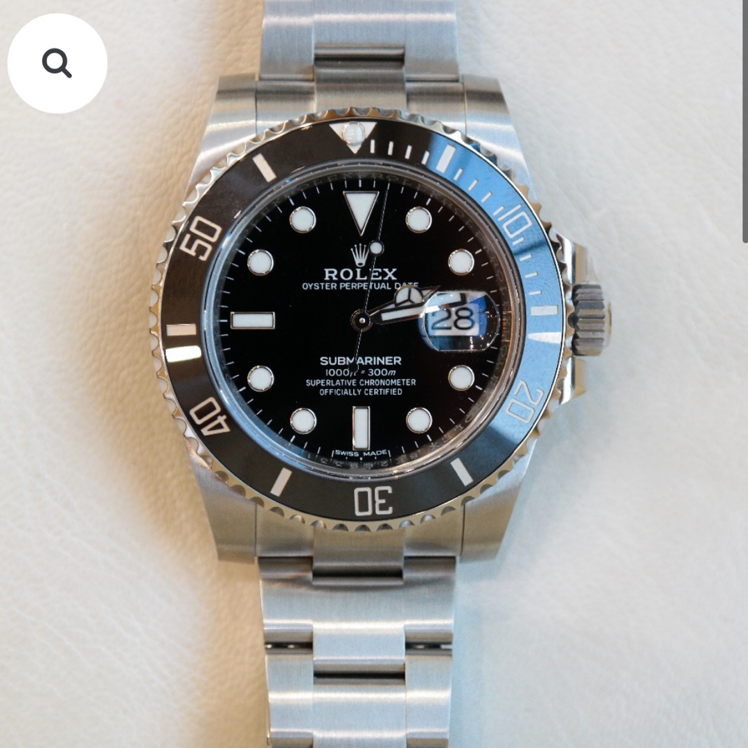 PRE-OWNED ROLEX SUBMARINER DATE