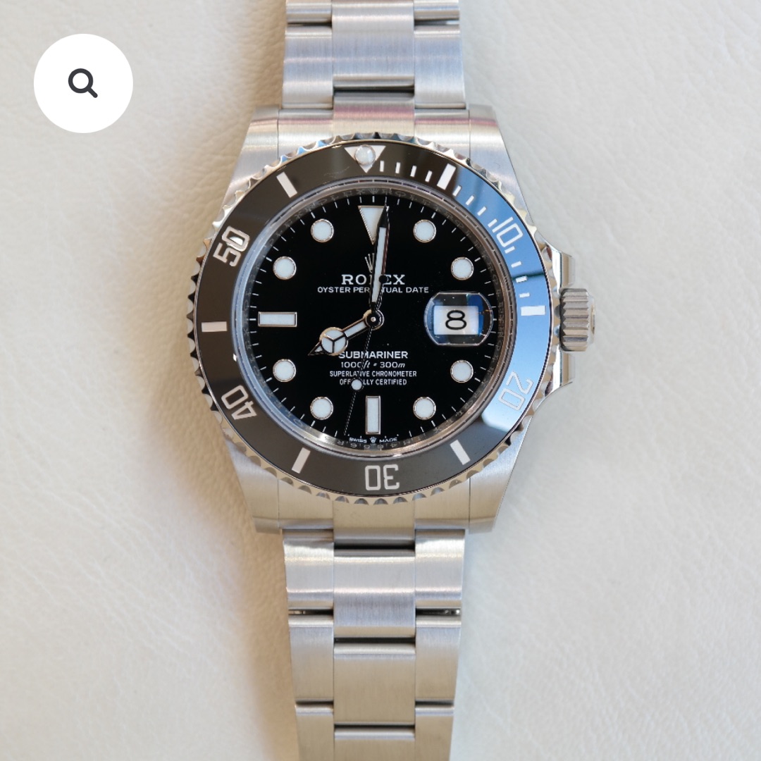 PRE-OWNED ROLEX SUBMARINER DATE