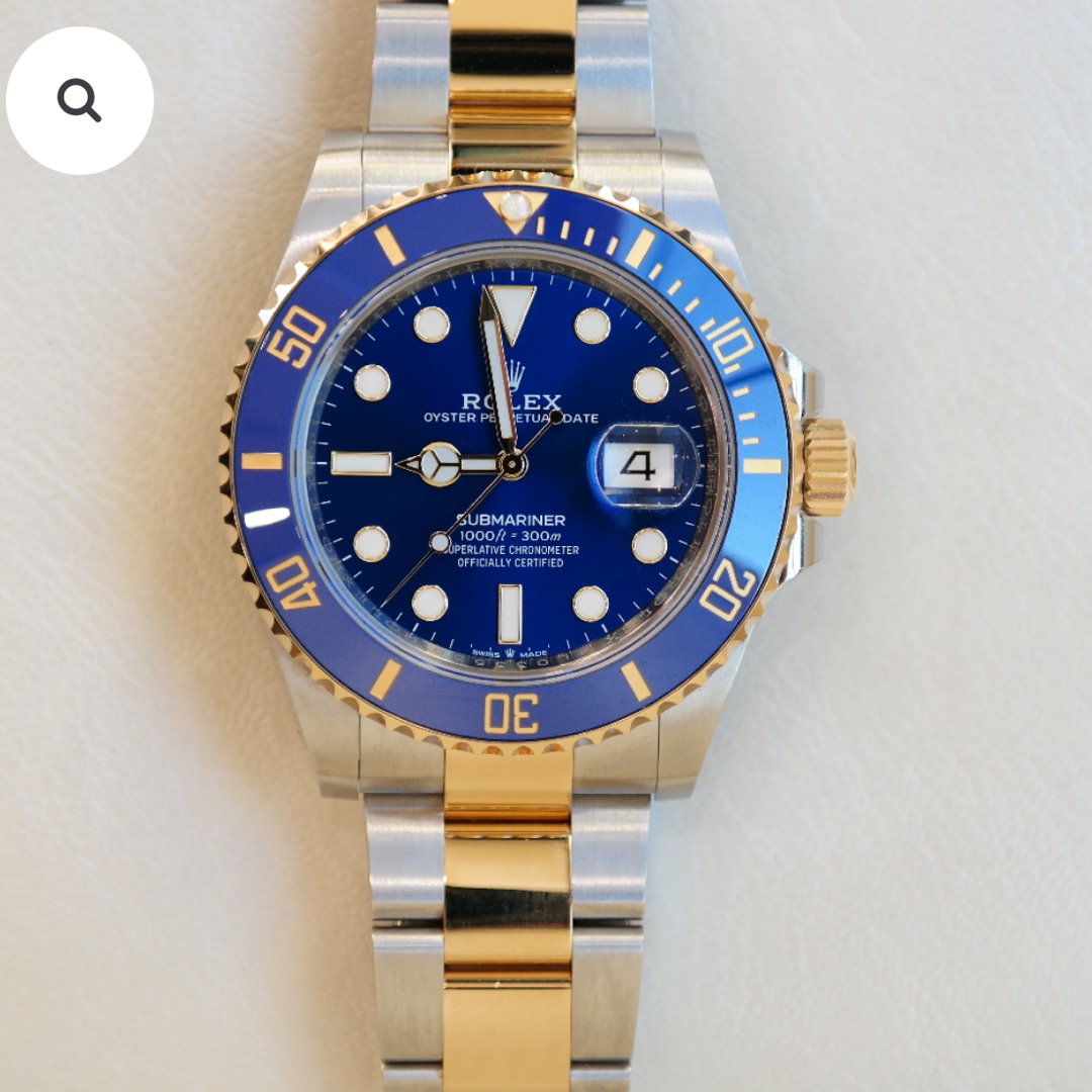 PRE-OWNED ROLEX SUBMARINER DATE